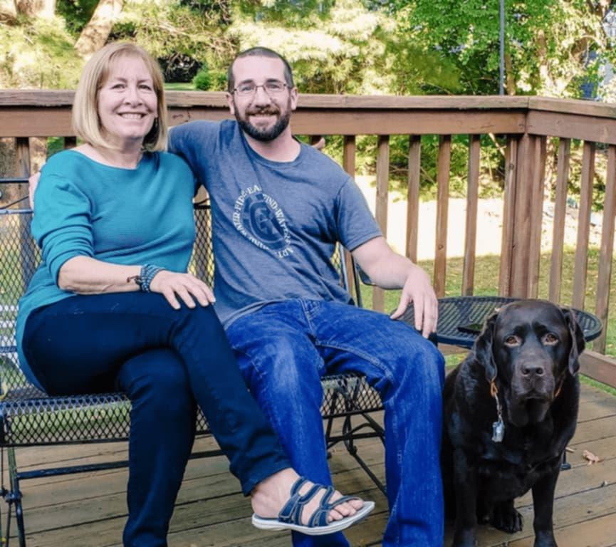 Barbara and Joe with their dog.