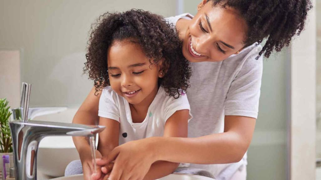 mother and child washing hands