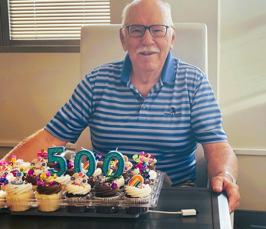 Frank Meuers smiling with cake