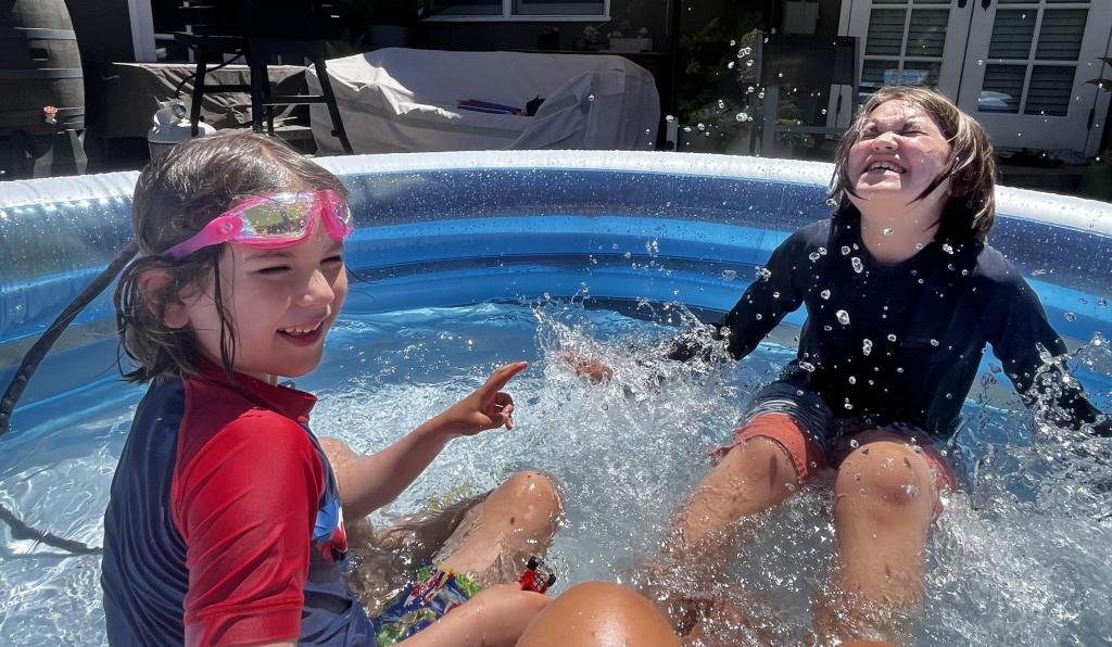 Jax and Lincoln Ramirez in pool