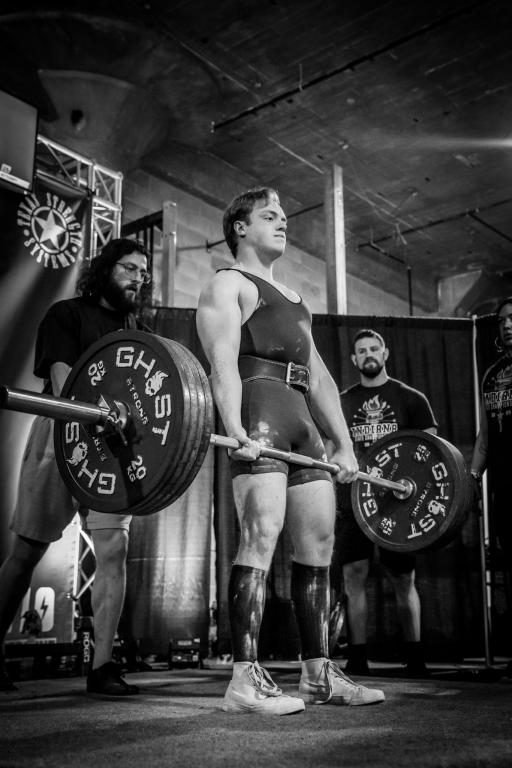 Miles Temple lifting weights