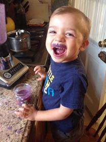 Sebastien with a purple smoothie mustache.