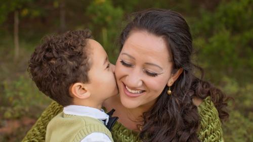 son kisses mother on cheek