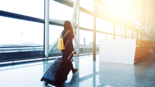 Girl walking with a suitcase