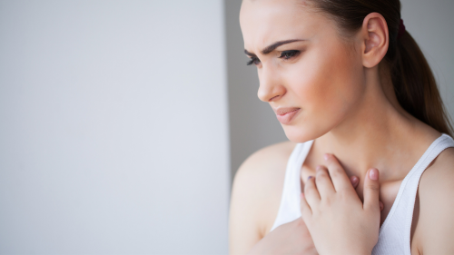 Woman holding chest