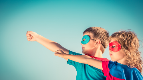 Two children dressed as superheroes 